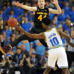 Arizona State' Kodi Justice defends against a pass by UCLA's Isaac Hamilton in the first half of an NCAA college basketball game in Los Angeles, Saturday, Jan. 9, 2016. UCLA won 81-74. (AP Photo/Michael Owen Baker)