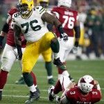 Green Bay Packers defensive end Mike Daniels (76) celebrates his sack on Arizona Cardinals quarterback Carson Palmer (3) during the first half of an NFL divisional playoff football game, Saturday, Jan. 16, 2016, in Glendale, Ariz. (AP Photo/Rick Scuteri)
