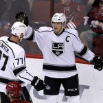 Los Angeles Kings' Dustin Brown, right, celebrates his goal against the Arizona Coyotes with Jeff Carter (77) during the second period of an NHL hockey game Saturday, Jan. 23, 2016, in Glendale, Ariz. (AP Photo/Ross D. Franklin)