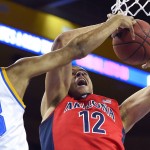 Arizona forward Ryan Anderson, right, shoots as UCLA guard Jonah Bolden defends during the first half of an NCAA college basketball game Thursday, Jan. 7, 2016, in Los Angeles, Calif. (AP Photo/Mark J. Terrill)