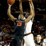 Oregon State's Langston Morris-Walker (13) shoots over Arizona State's Maurice O'Field during the first half of an NCAA college basketball game, Thursday, Jan. 28, 2016, in Tempe, Ariz. (AP Photo/Matt York)
