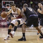 Cleveland Cavaliers' Matthew Dellavedova (8) drives past Phoenix Suns' P.J. Tucker (17) during the second half of an NBA basketball game Wednesday, Jan. 27, 2016, in Cleveland. (AP Photo/Tony Dejak)