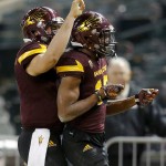 Arizona State wide receiver Tim White, right, celebrates his touchdown with quarterback Mike Bercovici (2) against West Virginia during the second half of the Cactus Bowl NCAA college football game, Saturday, Jan. 2, 2016, in Phoenix. (AP Photo/Ross D. Franklin)
