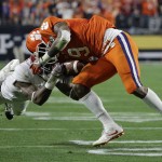 Clemson's Wayne Gallman (9) catches a pass with Alabama's Daylon Charlot defending during the second half of the NCAA college football playoff championship game Monday, Jan. 11, 2016, in Glendale, Ariz. (AP Photo/David J. Phillip)