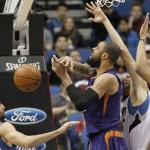 Phoenix Suns center Tyson Chandler, center, loses control of the ball under pressure from Minnesota Timberwolves forward Tayshaun Prince, right, and Timberwolves guard Ricky Rubio, left, of Spain, during the first half of an NBA basketball game in Minneapolis, Sunday, Jan. 17, 2016.  (AP Photo/Ann Heisenfelt)
