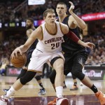 Cleveland Cavaliers' Timofey Mozgov (20), from Russia, drives past Phoenix Suns' Alex Len (21), from Ukraine, during the second half of an NBA basketball game Wednesday, Jan. 27, 2016, in Cleveland. The Cavaliers won 115-93. (AP Photo/Tony Dejak)