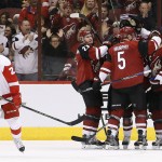 Arizona Coyotes' Oliver Ekman-Larsson (23), of Sweden, celebrates his goal with teammates Connor Murphy (5) and Shane Doan (19) as Detroit Red Wings' Tomas Tatar, left, of the Czech Republic, skates away from the celebration during the second period of an NHL hockey game Thursday, Jan. 14, 2016, in Glendale, Ariz. (AP Photo/Ross D. Franklin)