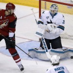 San Jose Sharks' Martin Jones, right, makes a save on a deflection by Arizona Coyotes' Martin Hanzal (11), of the Czech Republic, during the third period of an NHL hockey game Thursday, Jan. 21, 2016, in Glendale, Ariz. The Sharks defeated the Coyotes 3-1. (AP Photo/Ross D. Franklin)