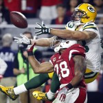 Arizona Cardinals cornerback Justin Bethel (28) breaks up a pass intended for Green Bay Packers wide receiver Jeff Janis (83) during the first half of an NFL divisional playoff football game, Saturday, Jan. 16, 2016, in Glendale, Ariz. (AP Photo/Ross D. Franklin)