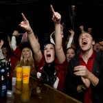 Alabama fan Alanna Jackson, of Foxboro, Mass., cheers after Alabama defeated Clemson 45-40 in the NCAA college playoff championship football game at Gallettes Bar, Monday, Jan. 11, 2016, in Tuscaloosa, Ala. (AP Photo/Brynn Anderson)