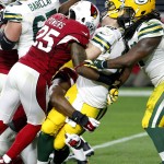 
              FILE - In this Dec. 27, 2015, file photo, Green Bay Packers quarterback Aaron Rodgers (12) is sacked by Arizona Cardinals cornerback Jerraud Powers (25) during the second half of an NFL football game, in Glendale, Ariz. Three weeks ago, the Arizona Cardinals beat the Green Bay Packers by 30 points. No one should expect that kind of blowout when the teams meet again Saturday night, this time in the NFC divisional playoffs. (AP Photo/Ross D. Franklin, File)
            