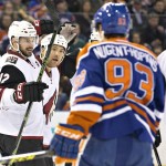 Arizona Coyotes' Brad Richardson (12) and Steve Downie (17) celebrate a goal against the Edmonton Oilers during first period NHL action in Edmonton, on Saturday, Jan. 2, 2016. (Jason Franson/The Canadian Press via AP)