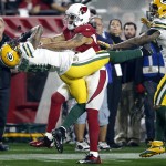 Green Bay Packers free safety Ha Ha Clinton-Dix (21) intercepts a pass intended for Arizona Cardinals wide receiver Michael Floyd (15) during the second half of an NFL divisional playoff football game, Saturday, Jan. 16, 2016, in Glendale, Ariz. (AP Photo/Rick Scuteri)