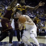 California's Sam Singer (2) looks for a way around Arizona State's Gerry Blakes, left, and Obinna Oleka in the second half of an NCAA college basketball game Thursday, Jan. 21, 2016, in Berkeley, Calif. (AP Photo/Ben Margot)
