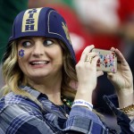 A Notre Dame fan takes a picture before the Fiesta Bowl NCAA College football game against Ohio State, Friday, Jan. 1, 2016, in Glendale, Ariz.  (AP Photo/Ross D. Franklin)