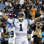 Carolina Panthers' Cam Newton celebrates Ted Ginn's run for a touchdown during the first half the NFL football NFC Championship game against the Arizona Cardinals, Sunday, Jan. 24, 2016, in Charlotte, N.C. (AP Photo/Mike McCarn)