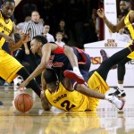 Arizona's Parker Jackson-Cartwright (0) collides with Arizona State's Willie Atwood (2) at mid-court during the first half of an NCAA college basketball game, Sunday, Jan. 3, 2016, in Tempe, Ariz. (AP Photo/Ralph Freso)