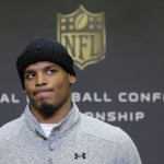 Carolina Panthers quarterback Cam Newton ponders a question during a news conference in advance of the NFC Championship game against the Arizona Cardinals in Charlotte, N.C., Wednesday, Jan. 20, 2016. (AP Photo/Chuck Burton)