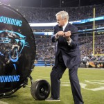 Carolina Panthers owner Jerry Richardson  hits a drum before the NFL football NFC Championship game against the Arizona Cardinals, Sunday, Jan. 24, 2016, in Charlotte, N.C. (AP Photo/Mike McCarn)