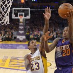 Phoenix Suns guard Archie Goodwin, right, shoots as Los Angeles Lakers guard Louis Williams defends during the first half of an NBA basketball game Sunday, Jan. 3, 2016, in Los Angeles. (AP Photo/Mark J. Terrill)