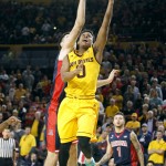 Arizona State's Tra Holder (0) drives to the basket past Arizona's Dustan Ristic during the first half of an NCAA college basketball game, Sunday, Jan. 3, 2016, in Tempe, Ariz. (AP Photo/Ralph Freso)