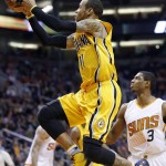 Indiana Pacers' Monta Ellis (11) drives past Phoenix Suns' Brandon Knight (3) during the first half of an NBA basketball game, Tuesday, Jan. 19, 2016, in Phoenix. (AP Photo/Ross D. Franklin)