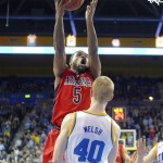 Arizona guard Kadeem Allen, left, shoots as UCLA center Thomas Welsh defends during the second half of an NCAA college basketball game, Thursday, Jan. 7, 2016, in Los Angeles. UCLA won 87-84. (AP Photo/Mark J. Terrill)