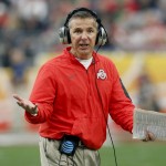 Ohio State head coach Urban Meyer makes a call during the first half of the Fiesta Bowl NCAA College football game against Notre Dame, Friday, Jan. 1, 2016, in Glendale, Ariz.  (AP Photo/Rick Scuteri)
