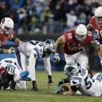 Carolina Panthers' Luke Kuechly recovers a fumble by Arizona Cardinals' Carson Palmer during the first half the NFL football NFC Championship game Sunday, Jan. 24, 2016, in Charlotte, N.C. (AP Photo/Bob Leverone)