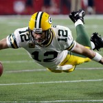 Green Bay Packers quarterback Aaron Rodgers (12) dives for extra yards during the first half of an NFL divisional playoff football game against the Arizona Cardinals, Saturday, Jan. 16, 2016, in Glendale, Ariz. (AP Photo/Ross D. Franklin)