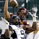 West Virginia safety KJ Dillon (9) breaks up a pass intended for Arizona State wide receiver D.J. Foster (8) during the second half of the Cactus Bowl NCAA college football game, Saturday, Jan. 2, 2016, in Phoenix. (AP Photo/Ross D. Franklin)