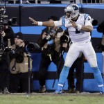 Carolina Panthers' Cam Newton celebrates after a touchdown run during the second half the NFL football NFC Championship game against the Arizona Cardinals,  Sunday, Jan. 24, 2016, in Charlotte, N.C. (AP Photo/David J. Phillip)