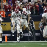 Alabama's O.J. Howard (88) celebrates his touchdown catch with quarterback Jake Coker during the second half of the NCAA college football playoff championship game Monday, Jan. 11, 2016, in Glendale, Ariz. (AP Photo/David J. Phillip)