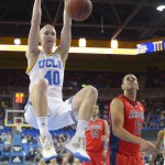 UCLA center Thomas Welsh, left, dunks as Arizona forward Ryan Anderson watches during the first half of an NCAA college basketball game, Thursday, Jan. 7, 2016, in Los Angeles. (AP Photo/Mark J. Terrill)