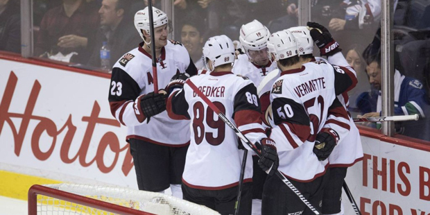 Arizona Coyotes right wing Shane Doan (19) celebrates his goal against the Vancouver Canucks with h...