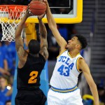 UCLA's Jonah Bolden blocks a shot by Arizona State's Willie Atwood in the second half of an NCAA college basketball game in Los Angeles, Saturday, Jan. 9, 2016. UCLA won 81-74. (AP Photo/Michael Owen Baker)