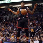 Miami Heat forward Gerald Green reacts after dunking the ball against the Phoenix Suns during the second quarter during an NBA basketball game Friday, Jan. 8, 2016, in Phoenix. (AP Photo/Rick Scuteri)