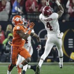Alabama's Eddie Jackson (4) intercepts a pass in front of Clemson's Ray-Ray McCloud during the first half of the NCAA college football playoff championship game Monday, Jan. 11, 2016, in Glendale, Ariz. (AP Photo/Chris Carlson)