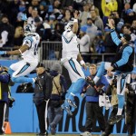 Carolina Panthers' Cam Newton and Joe Webb celebrate a touchdown run during the first half the NFL football NFC Championship game against the Arizona Cardinals Sunday, Jan. 24, 2016, in Charlotte, N.C. (AP Photo/David J. Phillip)