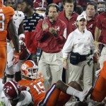 Alabama head coach Nick Saban claps after a punt return during the first half of the NCAA college football playoff championship game against Clemson Monday, Jan. 11, 2016, in Glendale, Ariz. (AP Photo/David J. Phillip)