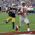 Ohio State running back Ezekiel Elliott (15) scores his fourth touchdown of the game against Notre Dame during the second half of the Fiesta Bowl NCAA College football game, Friday, Jan. 1, 2016, in Glendale, Ariz.  (AP Photo/Ross D. Franklin)