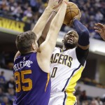 Indiana Pacers forward C.J. Miles (0) shoots over Phoenix Suns forward Mirza Teletovic (35) during the first half of an NBA basketball game in Indianapolis, Tuesday, Jan. 12, 2016. (AP Photo/Michael Conroy)