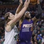 Boston Celtics center Kelly Olynyk (41) attempts to block a shot by Phoenix Suns guard Sonny Weems (10) during the second half of an NBA basketball game Friday, Jan. 15, 2016, in Boston. The Celtics defeated the Suns 117-103. (AP Photo/Stephan Savoia)