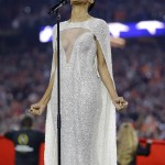 Ciara sings the national anthem before the NCAA college football playoff championship game between Clemson and Alabama Monday, Jan. 11, 2016, in Glendale, Ariz. (AP Photo/David J. Phillip)