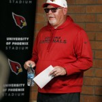 Arizona Cardinals coach Bruce Arians arrives for a news conference at the NFL football team's training facility Wednesday, Jan. 20, 2016, in Tempe, Ariz. The Cardinals will face the Carolina Panthers in the NFC championship game Sunday in Charlotte. (AP Photo/Ross D. Franklin)