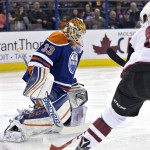 Arizona Coyotes' Tobias Rieder (8) is stopped by Edmonton Oilers' goalie Cam Talbot (33) during first period NHL action in Edmonton, on Saturday, Jan. 2, 2016. (Jason Franson/The Canadian Press via AP)
