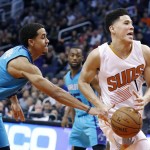 Charlotte Hornets' Brian Roberts, left, strips the ball from Phoenix Suns' Devin Booker (1) during the second half of an NBA basketball game, Wednesday, Jan. 6, 2016, in Phoenix. The Suns defeated the Hornets 111-102. (AP Photo/Ross D. Franklin)