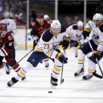 Buffalo Sabres center Sam Reinhart (23) carries the puck against the Arizona Coyotes in the first period during an NHL hockey game Monday, Jan. 18, 2016, in Glendale, Ariz. (AP Photo/Rick Scuteri)