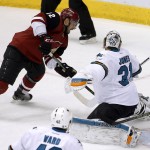 Arizona Coyotes' Brad Richardson (12) scores a goal against San Jose Sharks' Martin Jones during the third period of an NHL hockey game Thursday, Jan. 21, 2016, in Glendale, Ariz. The Sharks defeated the Coyotes 3-1. (AP Photo/Ross D. Franklin)