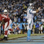 Carolina Panthers' Cam Newton celebrates his touchdown run during the first half the NFL football NFC Championship game against the Arizona Cardinals, Sunday, Jan. 24, 2016, in Charlotte, N.C. (AP Photo/David J. Phillip)